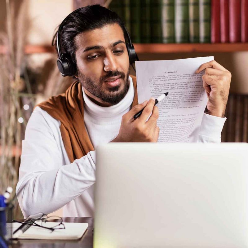 teacher-at-laptop-having-online-class-with-remote-8ZS3692.jpg